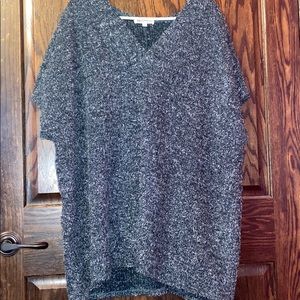 A dark green sparkly poncho.